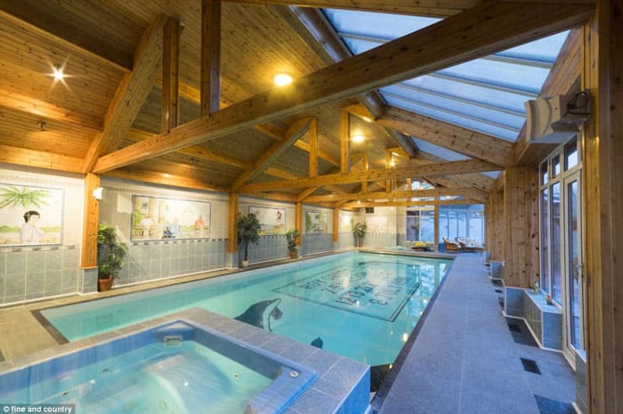 How lottery winners live: Metal worker who won the £7.4-million jackpot in 1998 puts his luxury home up for sale (including his winning numbers built into the pool)